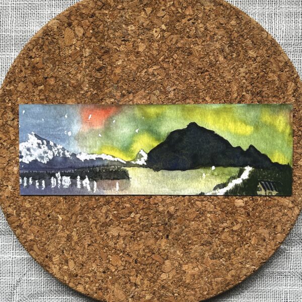 The front of a bookmark printed with Nikki's "Aurora Australis 1" painting.